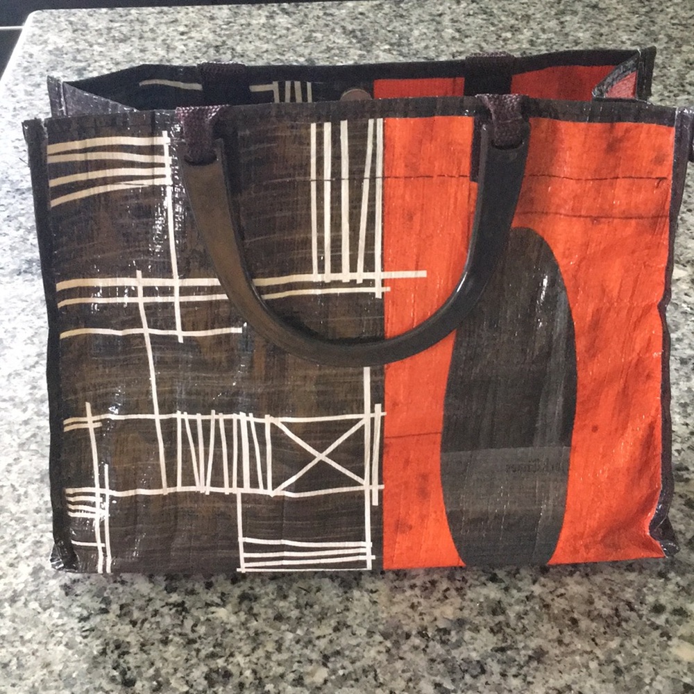 Blue Q handbag with plastic handle.